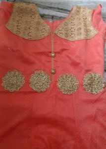 Elegant Coral Dress with Gold Embellishments
