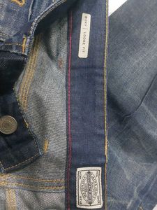 Distressed Blue Denim Jeans
