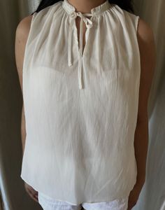 Elegant White Sleeveless Tie-Neck Top