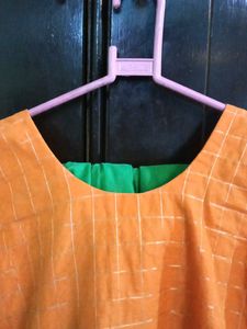 Orange kurta with golden border nakki lace