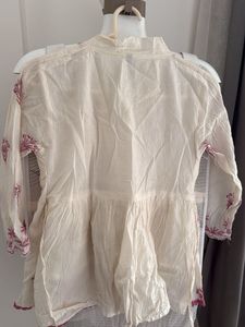 Embroidered Peplum Top
