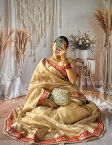 Elegant Golden Saree with Red Border