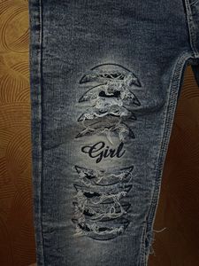 Distressed Denim Jeans with 'Girl' Graphic