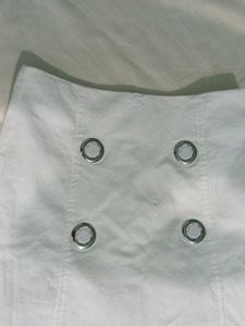 Chic White Mini Skirt with Grommet Detail