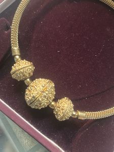 Elegant Gold Necklace with Textured Beads