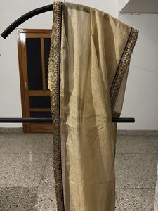 Elegant Golden saree with Embellished Border
