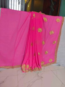 Elegant Pink Saree with Gold Embroidery