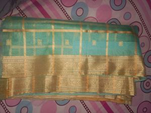 Elegant Teal & Gold Saree