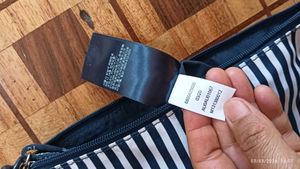 Chic Striped Sling Bag by Tommy Hilfiger