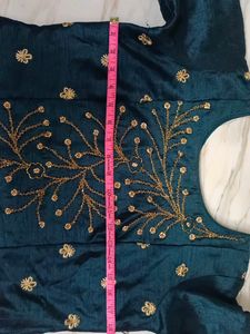 Its a Blue Dress.. With Beads Work On It.