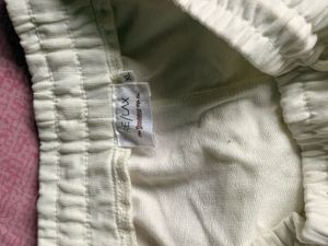 Cream Sweatshorts with Black Piping