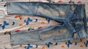 Light Wash Distressed Jeans with Unique Waistband