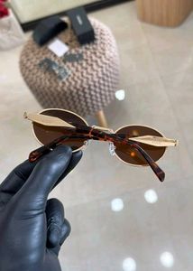 Prada Oval Sunglasses Gold Brown