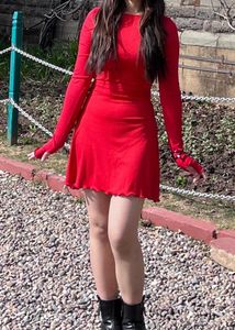 Rib knit long sleeve ruffle bodycon dress .