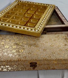 A SET OF 3 WOODEN PACKING TRAYS