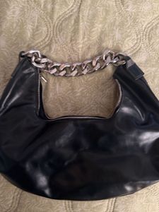 Black hobo bag with metal chain