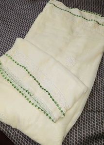 Elegant Cream Saree with Green Embellishments