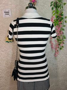 Women's black and white striped polo tee
