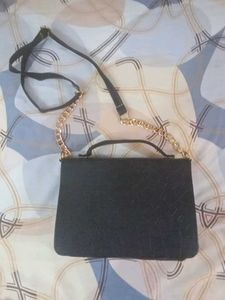 Chic Black Satchel Bag with Gold Accents