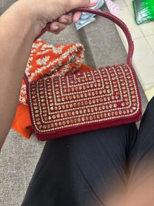 Red Embroidered saree and Blouse with Handbag