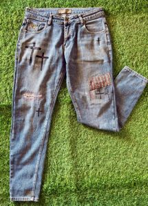 Distressed Blue Jeans with Cross Appliques