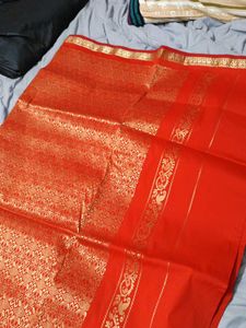 Vibrant Orange Saree with Gold Border