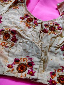 Embroidered silk blouse and plain pink saree