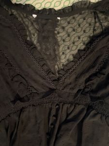 Elegant Black Sheer Blouse with Ruffle Detail