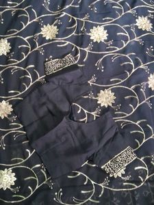 Elegant Black Saree with Gold Embellishments