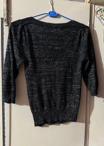Black stylish top with shimmery interlacing