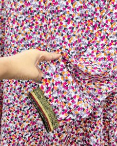 Chic Floral Print Top with Embellished Neckline