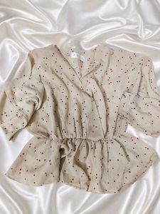 Chic Beige Heart Print Peplum Top