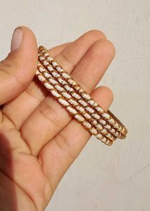 Elegant White Beaded Gold Bangles Set