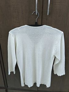 Chic White Knit Top with Lady Detail