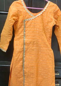 Orange kurta with golden border nakki lace