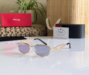 Prada Sunglasses - Gold Frame