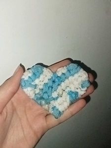 Heart-shaped bookmark on book page