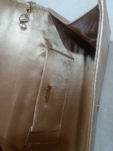 Mochi Gold Textured Clutch Bag