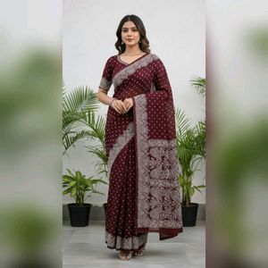 Burgundy saree having white design print.