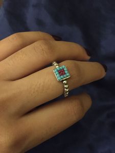 oxidised ring with terquoise and red beads.