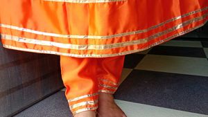 Vibrant Orange Kurta Set with Golden Accents