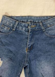 Distressed Blue Denim Jeans