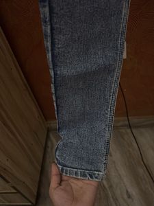 Distressed Denim Jeans with 'Girl' Graphic