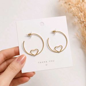 Gold Hoop Earrings with Heart Detail