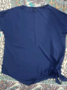 Navy blue top with knot in lower side