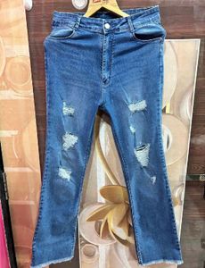 Distressed Blue Denim Jeans