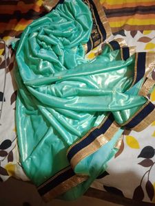 Stunning Teal Saree with Gold Border