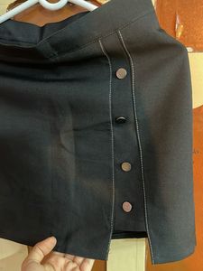Black button skirt, looks chic