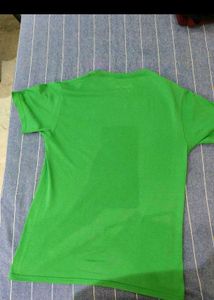 Green Tshirt with Tan shorts