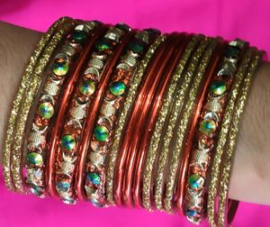 Orange And Golden Colour Bangles